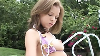 A Young Girl Pleasures Herself By The Pool