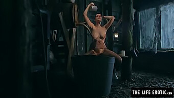 A Mature Woman With Prominent Nipples Pleasuring Herself Vigorously In A Dilapidated Shelter.